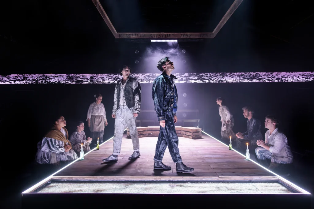 Caught between centuries, William and Richard stand apart in costuming that blurs the 1750s with now.