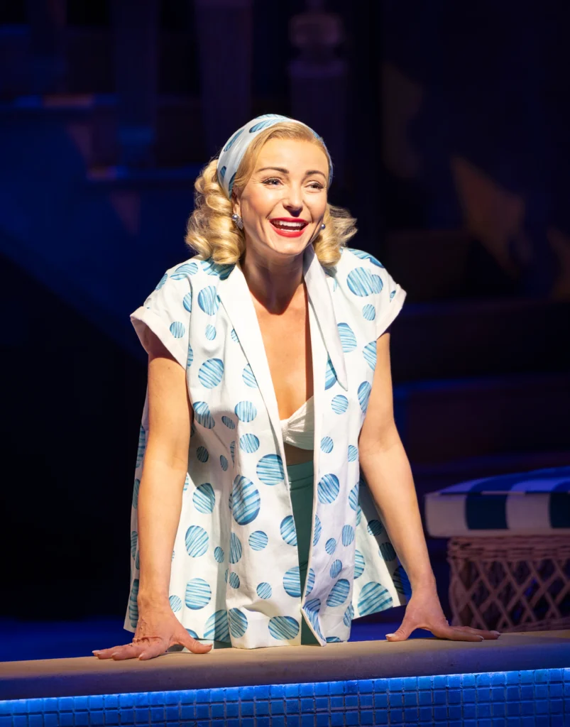 Helen George as Tracy Lord, poolside in High Society at the Barbican.