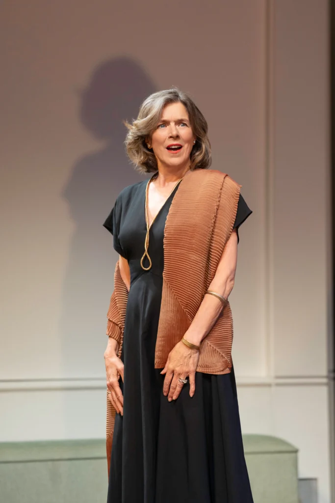 Janie Dee as Laurence, poise and elegance with something carefully concealed beneath. [Image Credit | Johan Persson]