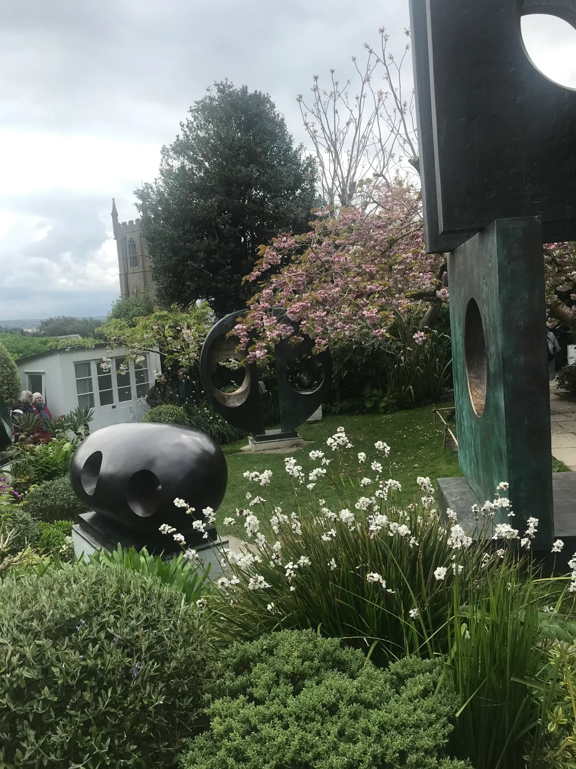 The garden at Trewyn, St Ives, where Hepworth's black bronzes stand among the colour she loved