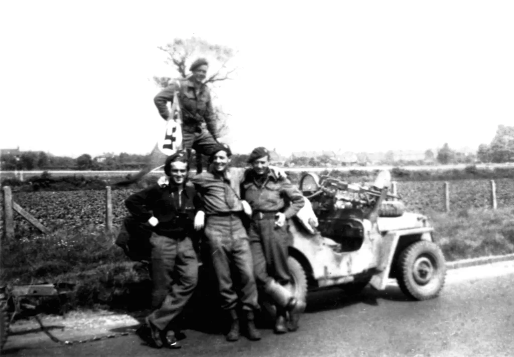 Weaver standing on the back of his jeep during the drive home from Operation Archway.