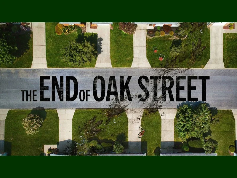 Aerial poster art for The End of Oak Street showing a suburban road with a scorch mark