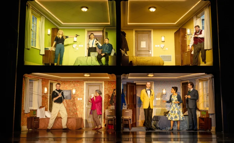 Comedy About Spies dollhouse hotel set with four rooms shown at once at the Adelphi Theatre