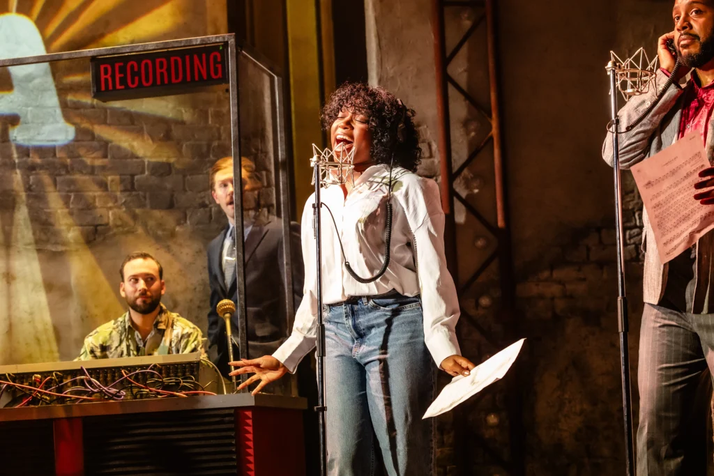 Charlote ST. Croix as Whitney Houston (centre) & the cast
