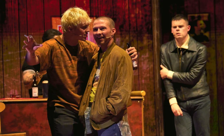 Trainspotting the Musical cast in a tense pub scene at the Theatre Royal Haymarket