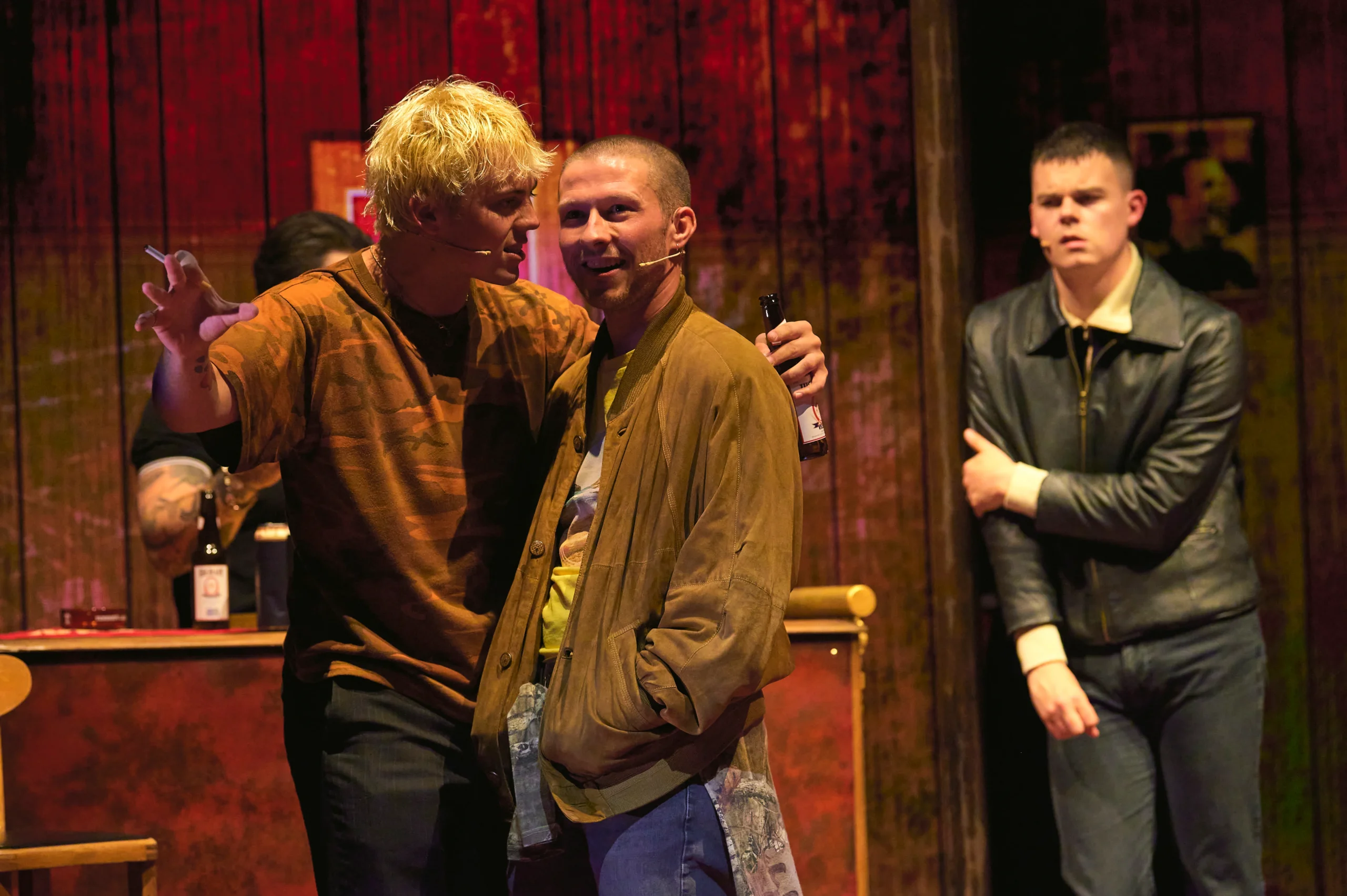 Trainspotting the Musical cast in a tense pub scene at the Theatre Royal Haymarket