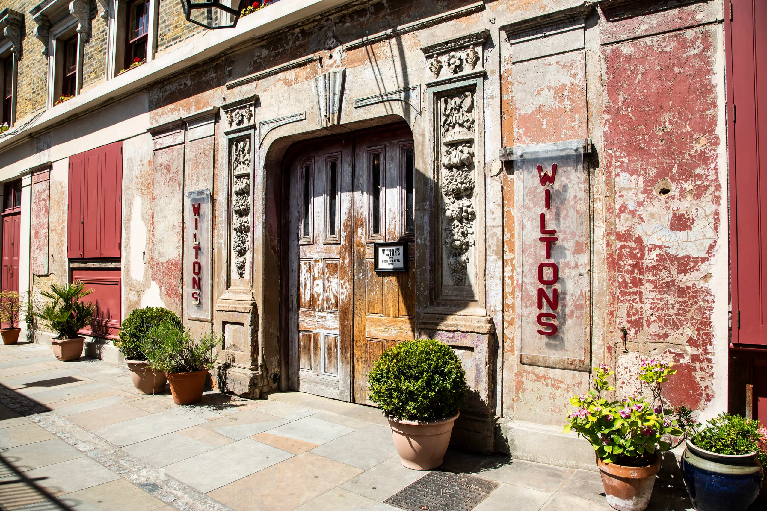 Weathered exterior of Wilton's Music Hall, a small London venue navigating the Let's Create Arts Council shift