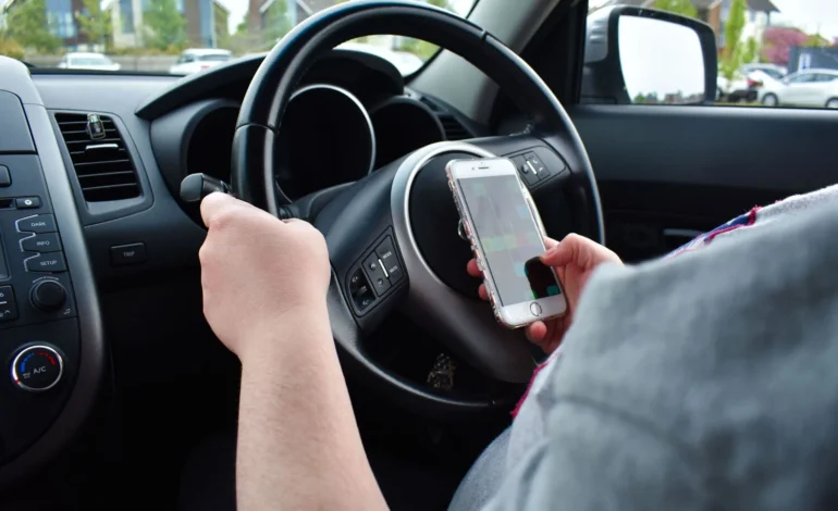Drivers face £200 fine and six points for using handheld phones behind the wheel