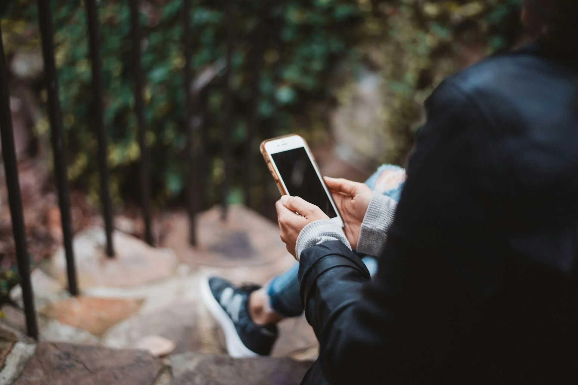 Person using a smartphone ai companion app to alleviate loneliness