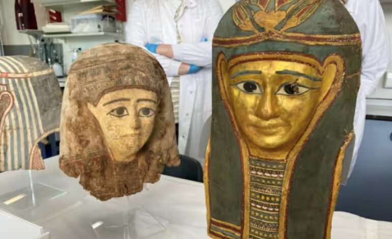 Egypt Exploration Society cartonnage mummy masks displayed during conservation work