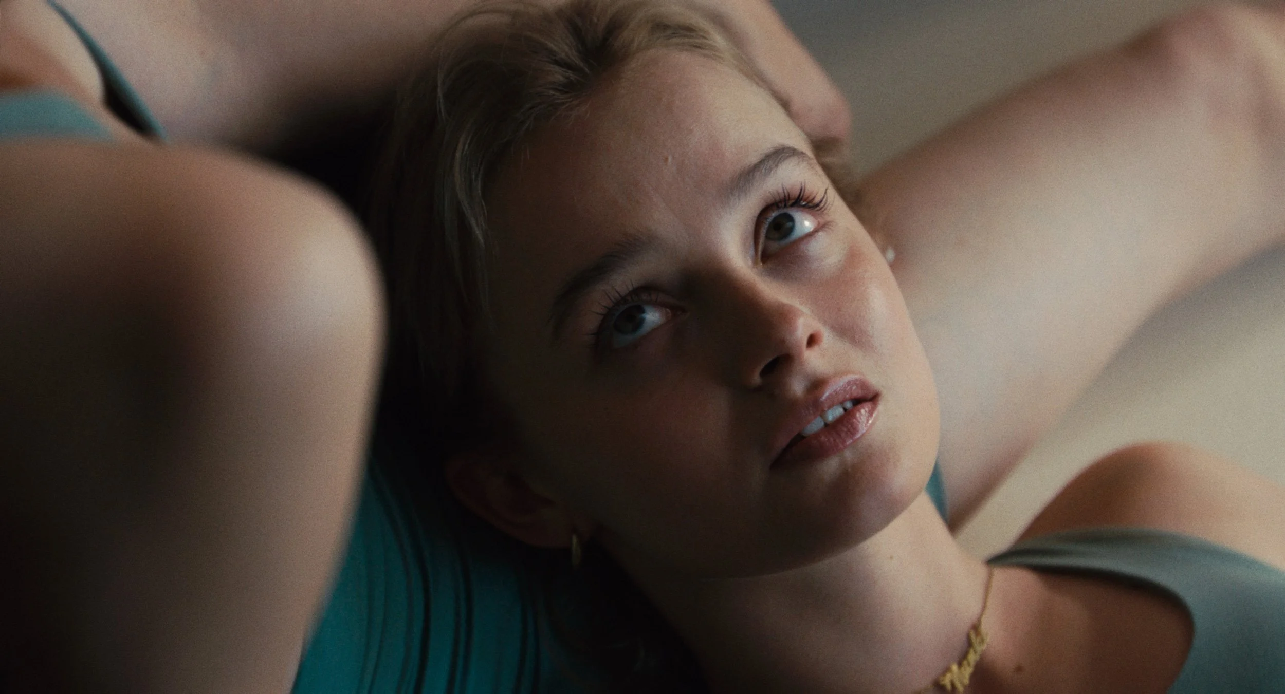 Maja Bons as Luca in Babystar, an intimate close-up from Joscha Bongard's family influencer satire
