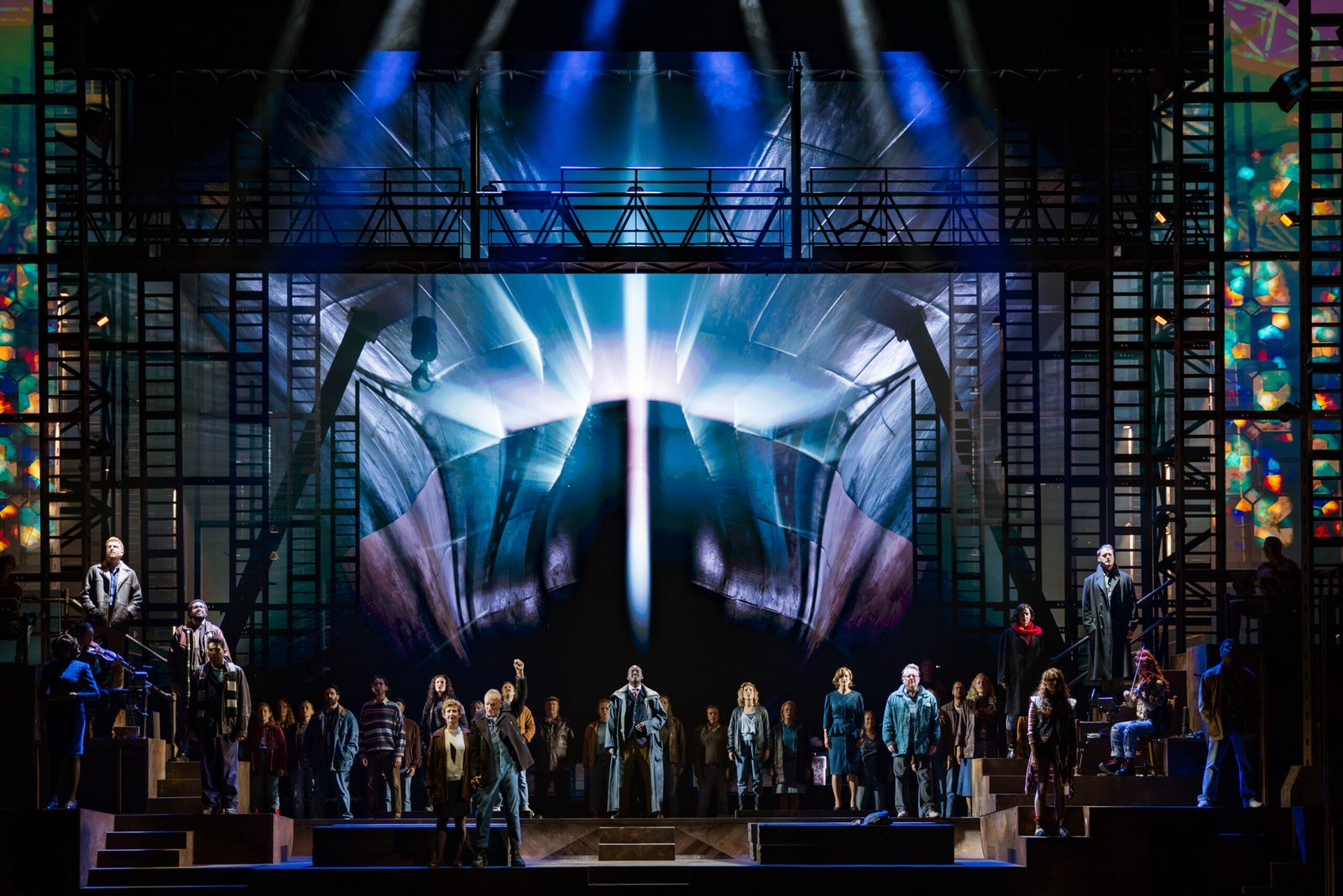 The Last Ship Sting musical company beneath the ship's bow video wall at Drury Lane